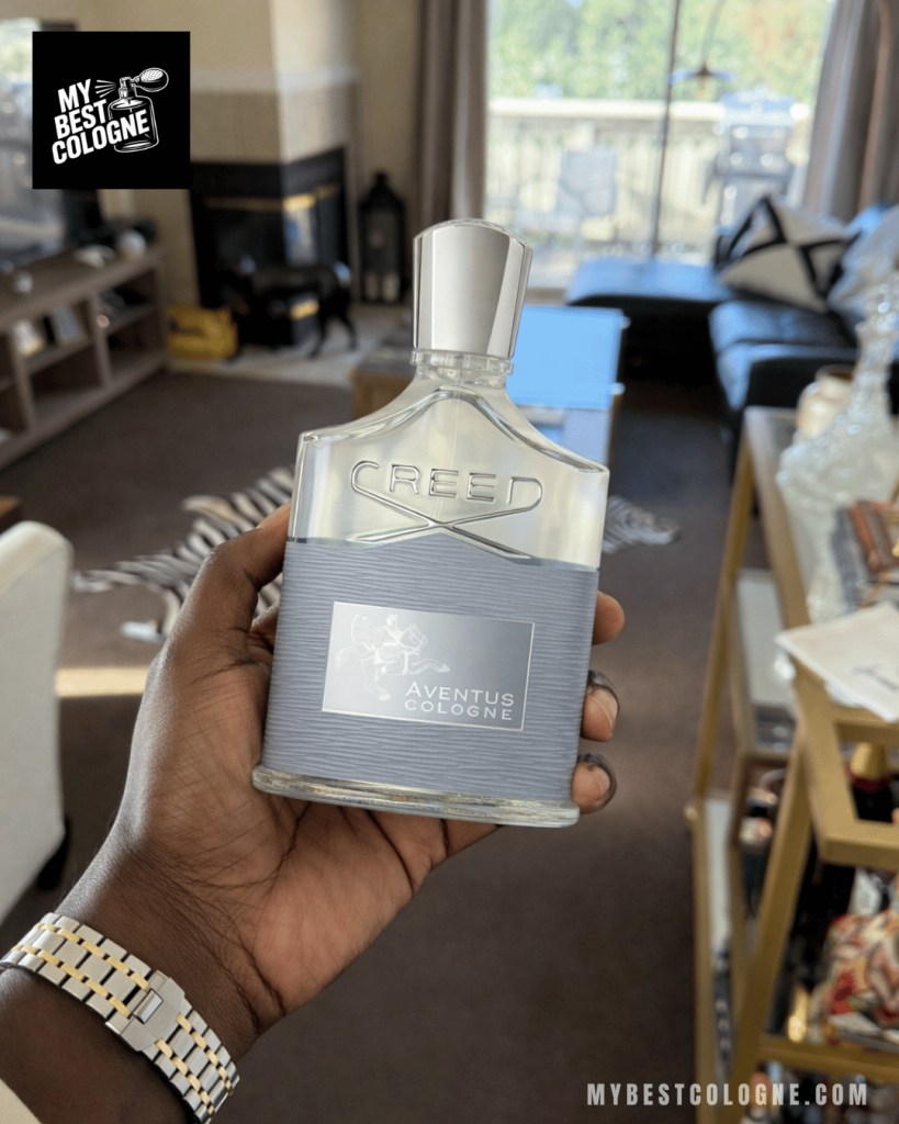Creed Aventus Cologne Bottle in hand